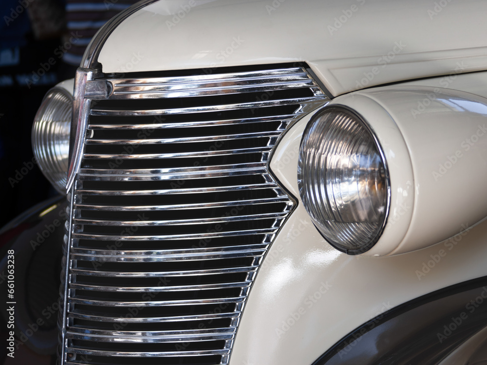 vintage car with a patina restored 1950 era style with a chromed front grill