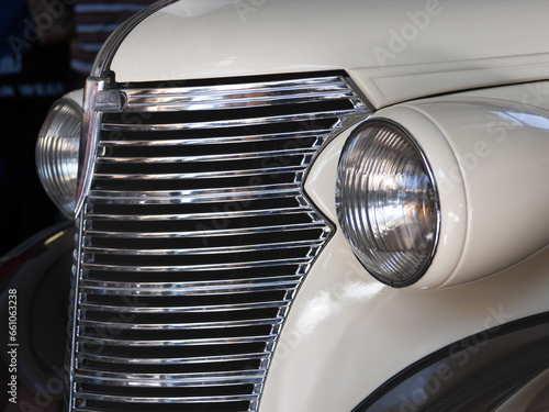 vintage car with a patina restored 1950 era style with a chromed front grill © poco_bw