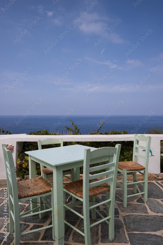 Table with idyllic sea view at a cozy greek tavern.