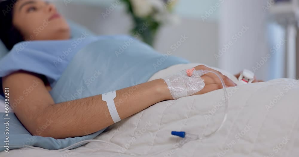 Hospital bed, emergency and nervous woman with iv drip in hand for