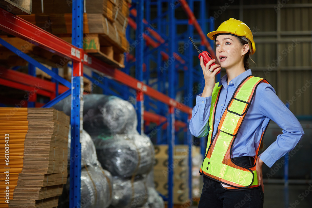 warehouse worker using walkie talkie talking about work and checking packages on shelf in storehouse warehouse worker using walkie talkie talking about work and checking packages on shelf in storehouse