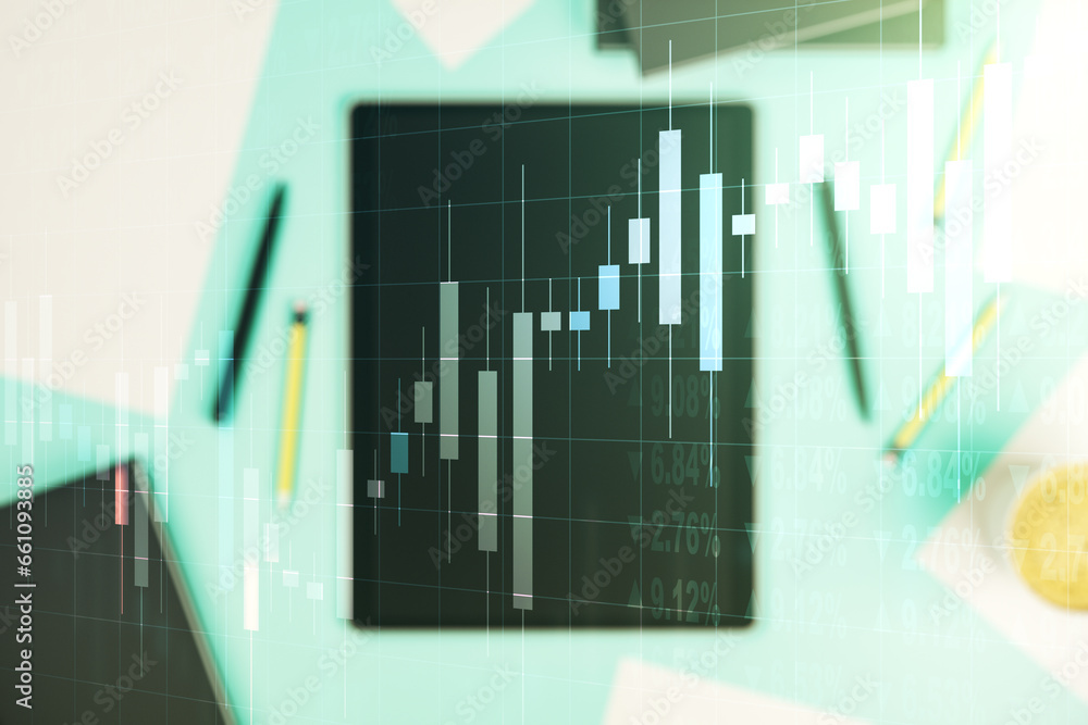Abstract creative financial graph and modern digital tablet on desktop on background, top view, financial and trading concept. Multiexposure Abstract creative financial graph and modern digital tablet on desktop on background, top view, financial and trading concept. Multiexposure