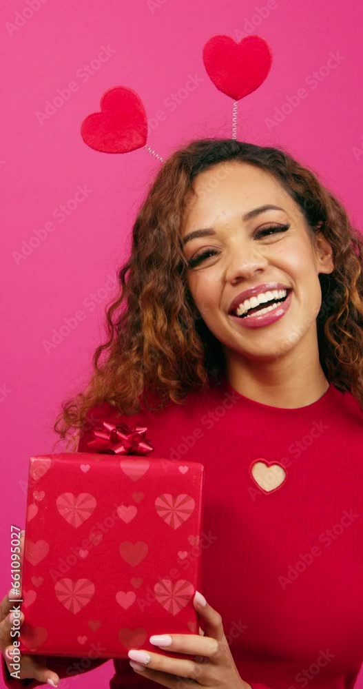 Beautiful young woman poses with gift box pink studio, Valentines or anniversary Beautiful young woman poses with gift box pink studio, Valentines or anniversary