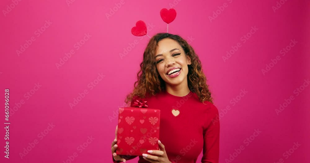 Beautiful young woman poses with gift box pink studio, Valentines or anniversary Beautiful young woman poses with gift box pink studio, Valentines or anniversary