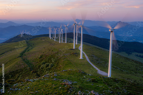 Windmills on Oiz mountain at sunset photo