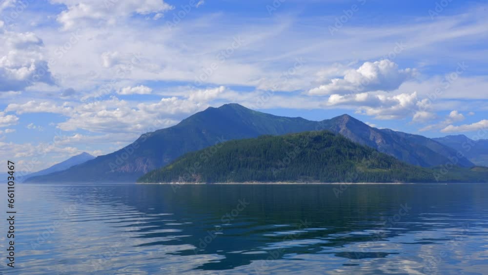 Establishing shot of lake with blue sky in Vancouver, Canada, North America. Day time on July 2023. Still camera view. ProRes 422 HQ. Establishing shot of lake with blue sky in Vancouver, Canada, North America. Day time on July 2023. Still camera view. ProRes 422 HQ.