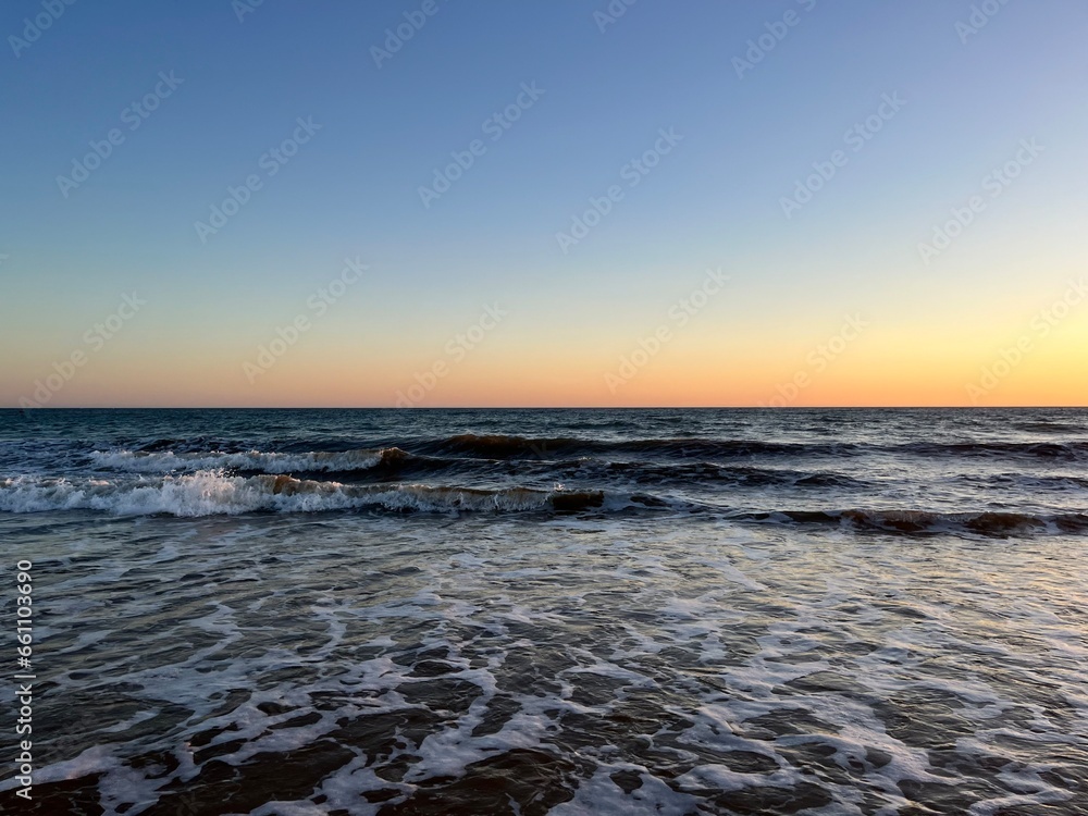 Quiet orange sea horizon, evening seascape background