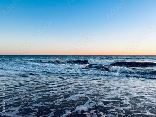 Quiet orange sea horizon, evening seascape background