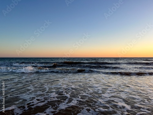 Quiet orange sea horizon  evening seascape background
