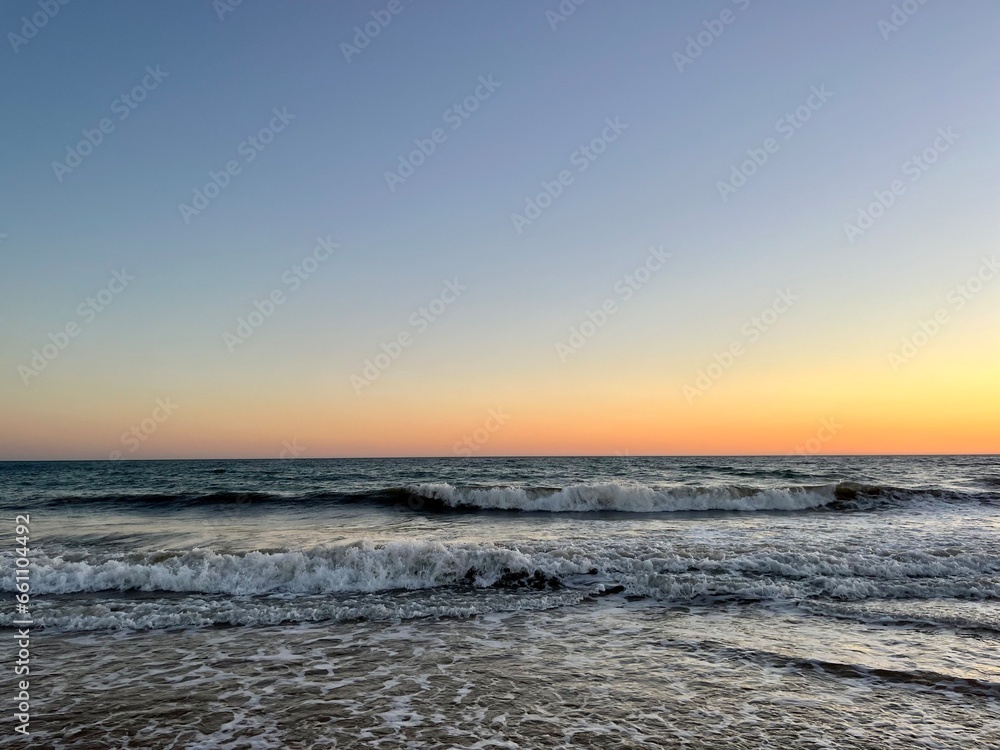 Quiet orange sea horizon, evening seascape background