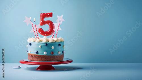 5th year birthday cake on isolated colorful pastel background photo