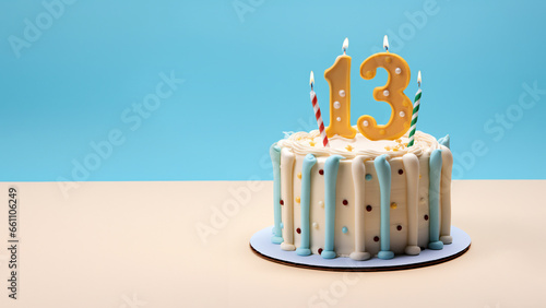 13th year birthday cake on isolated colorful pastel background