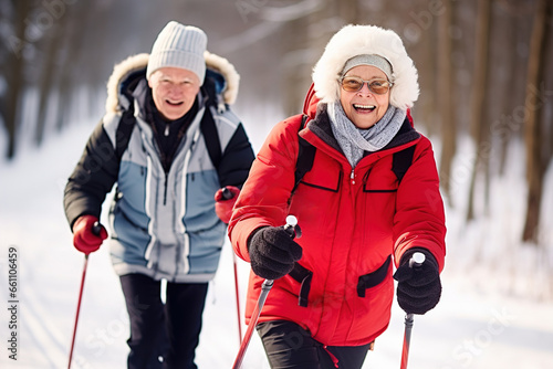 happy elderly couple skiing in the park, healthy lifestyle