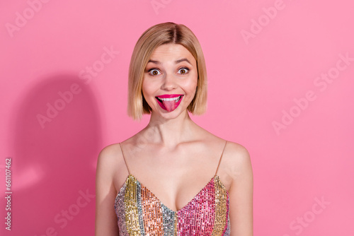 Фотография Photo of stylish festive young attractive woman tongue stick out joking childish