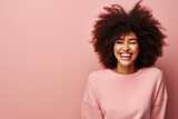 Giggling Young African American Woman with Big Natural Hair, Pink Sweater, Curly Locks