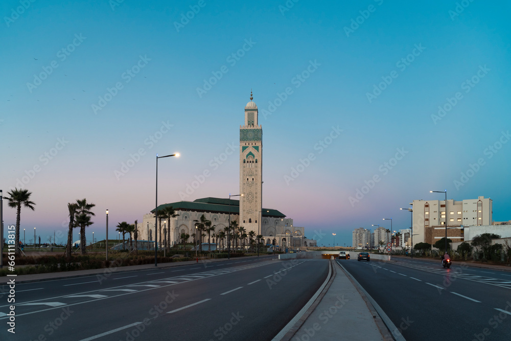view of Hassan II mosque from the street at sunset