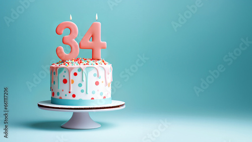 34th year birthday cake on isolated colorful pastel background photo