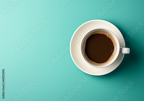 White coffee cup and saucer on a turquoise background. Minimalist concept. Viewed from above. AI generated