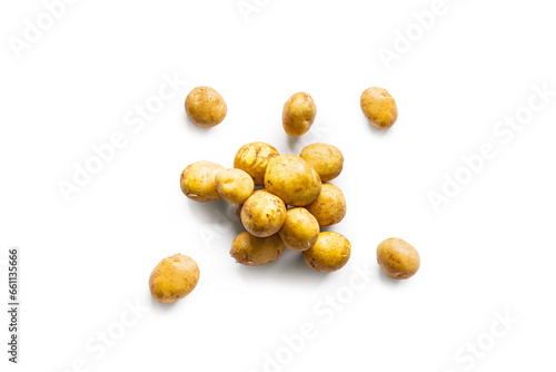 Closeup of a pile of fresh organic potatoes from the garden isolated on a white background from above, top view
