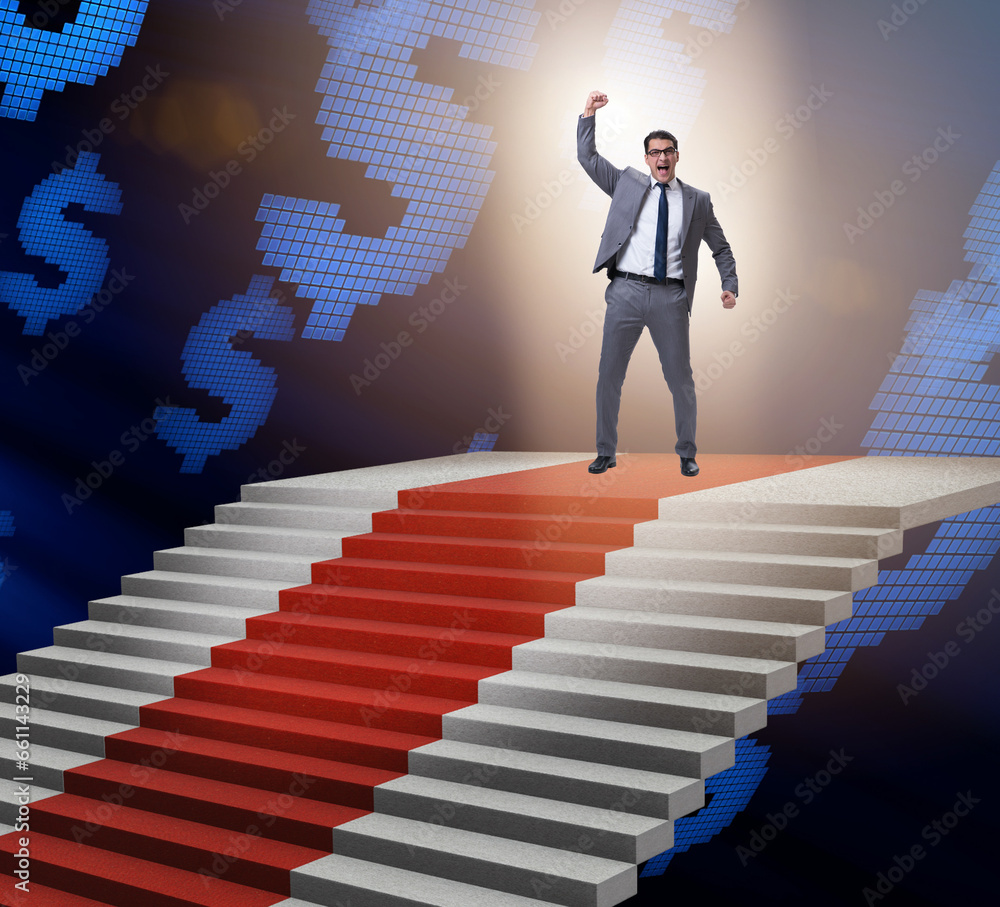 Young businessman climbing stairs and red carpet Young businessman climbing stairs and red carpet