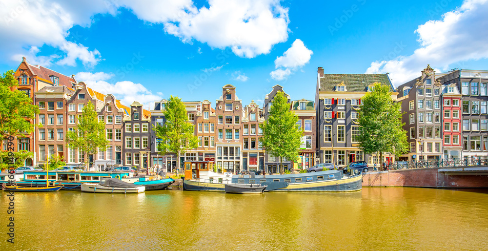 Amsterdam city skyline, colorful dancing houses over Singel canal, Netherlands