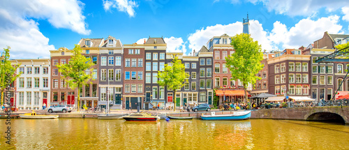 Panorama of Amsterdam city, scenic skyline over Amstel canal, Netherlands photo