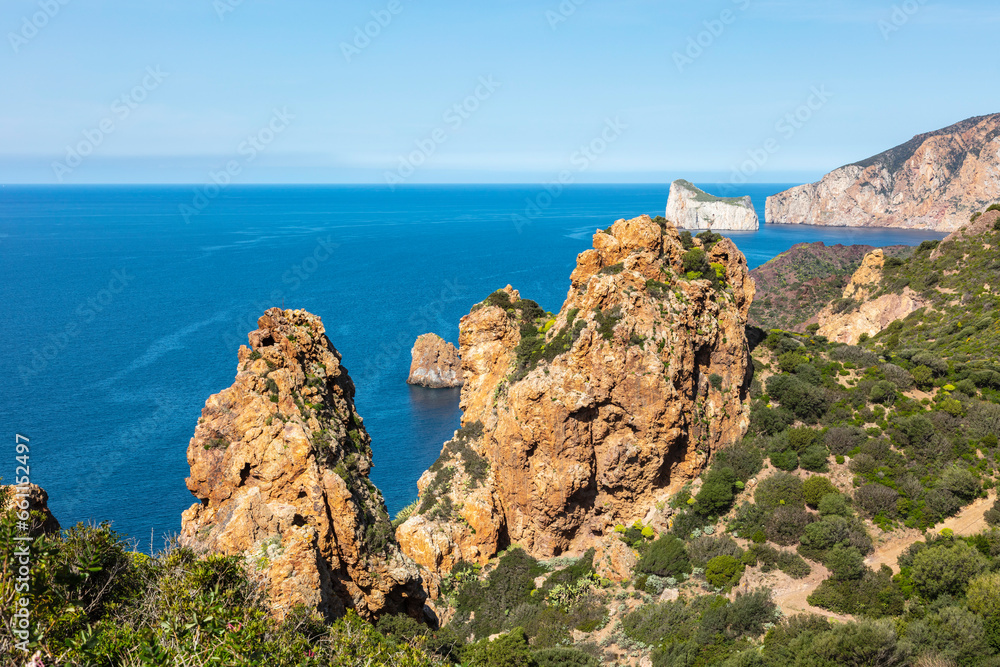 view of the sea and cliffs, pointy rocks, sardinia, italy
