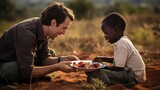 Heartwarming image: A volunteer shares a meal with an African child outdoors, embodying the spirit of generosity and compassion in the community.