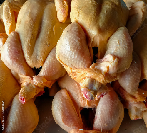 Tableau sur toile Clean yellow chickens in detail to use in the background, ready to sell at the butcher shop