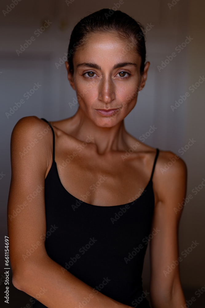portrait of a beautiful sexy brunette in a black bodysuit portrait of a beautiful sexy brunette in a black bodysuit