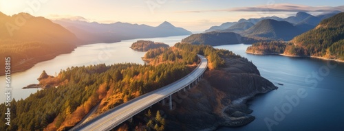 Aerial perspective of a winding section of the Sea to Sky Highway, showcasing the road's integration with the stunning coastal landscape.