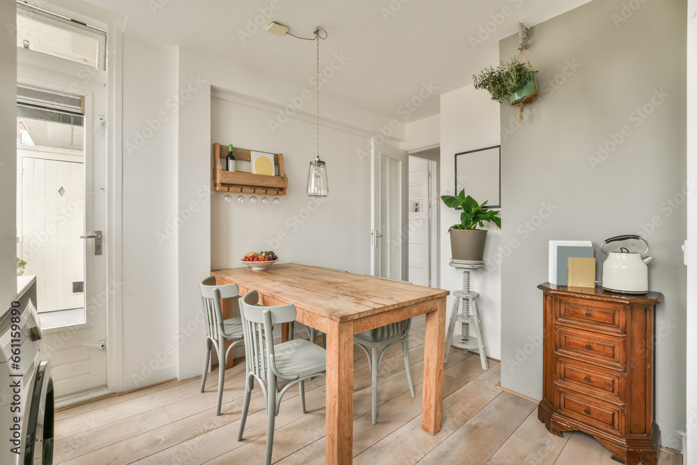 Dining room with table and chairs in apartment Dining room with table and chairs in apartment