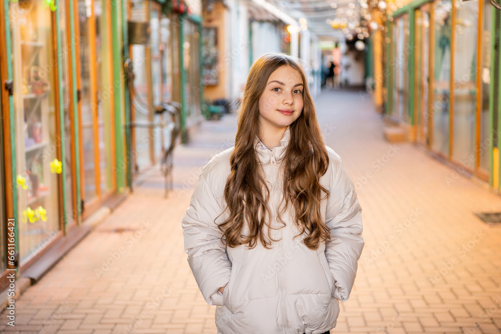 Fototapeta premium teen curly girl in the street. teen curly girl outdoor. teen curly girl wearing hat.