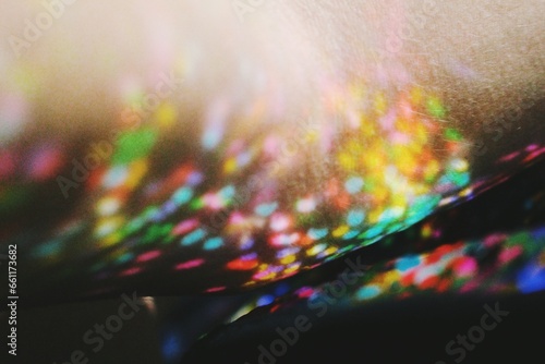 Bokeh colors of different lights reflecting on skin texture photo