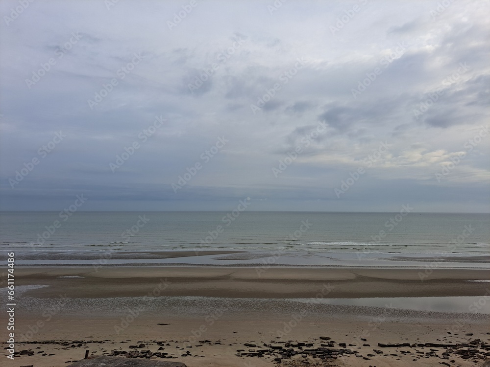 The French coast in summer, the coast with sunrise and sea waves. The French coast in summer, the coast with sunrise and sea waves.