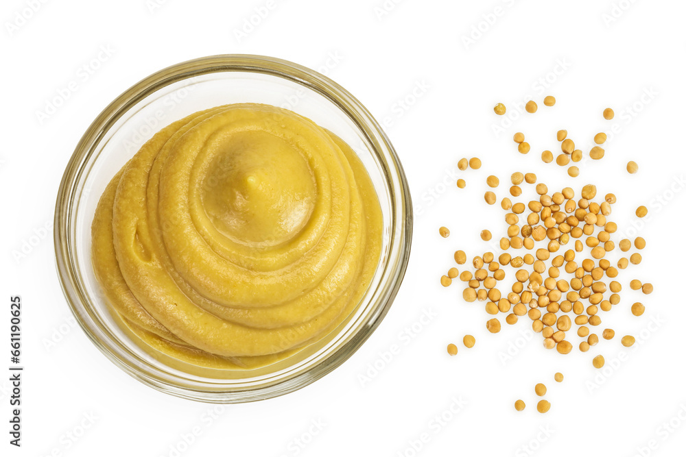 Mustard sauce in glass bowl with seed isolated on white background. Top view. Flat lay Mustard sauce in glass bowl with seed isolated on white background. Top view. Flat lay