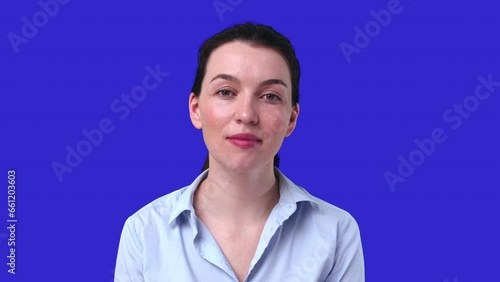 A Young Attractive Woman Participates in a Video Conference on BluScreen photo