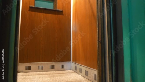 Breakdown to passenger elevator in residential building. Elevator doors jammed. Elevator does not work, doors will not close, video with sound