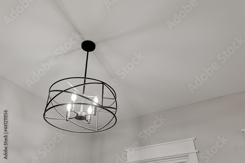 Round Metal Farmhouse Modern Light Fixture with Black Rod and Copyspace