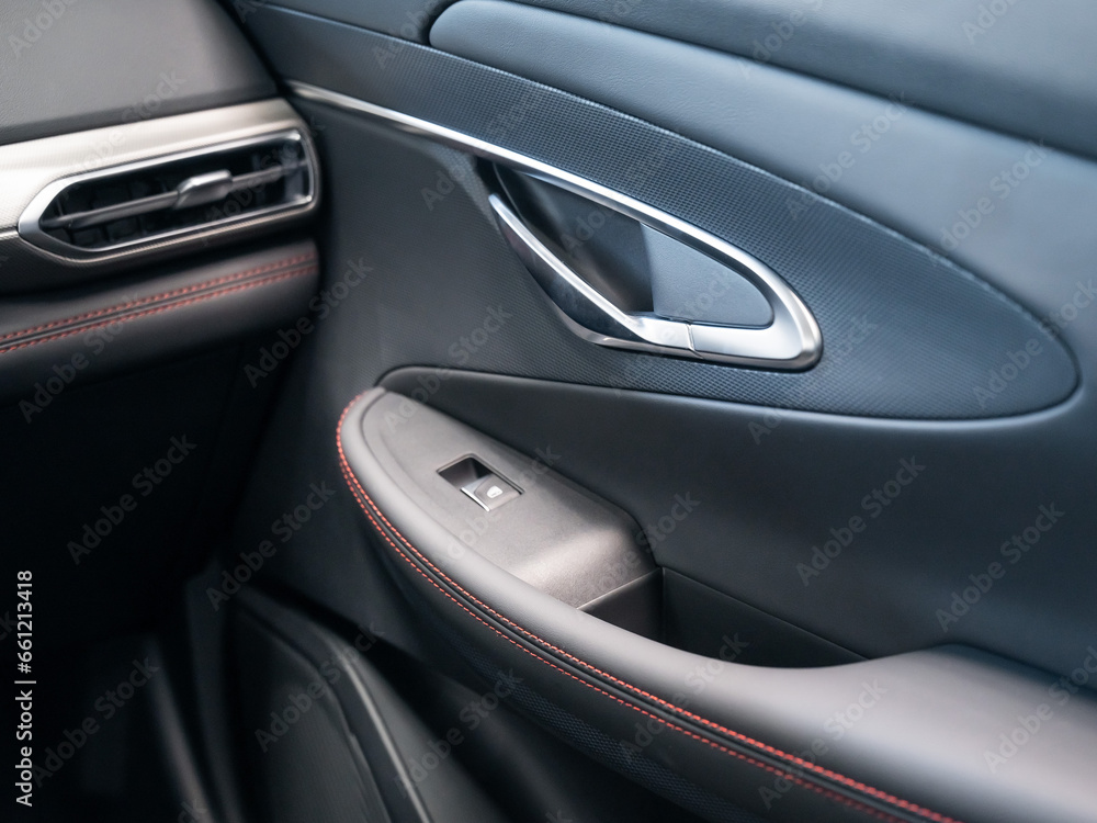 View of the car door inside the cabin. View of the car door inside the cabin.