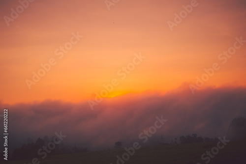 Sunrise covered by clouds in the countryside of southern of Brazil. 