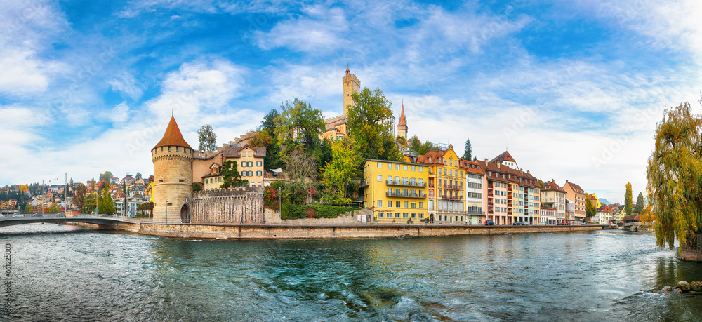 Fototapeta premium Outstanding historic city center of Lucerne with famous buildings and Nolliturm tower on Reuss river. Popular travel destination . Location: Lucerne, Canton of Lucerne, Switzerland, Europe
