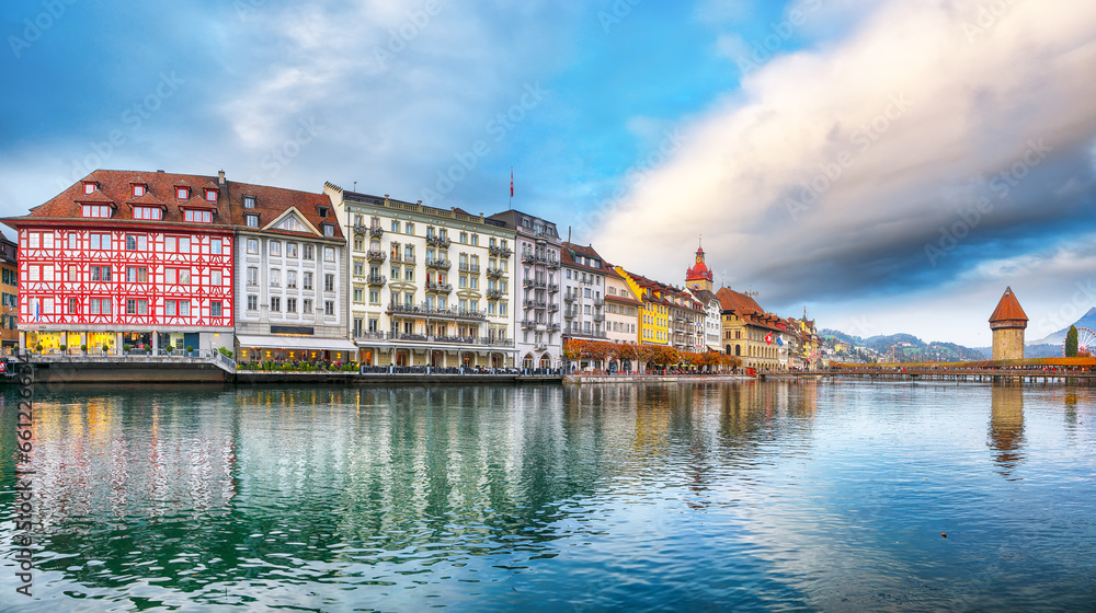 Breathtaking historic city center of Lucerne with famous buildings and old wooden Chapel Bridge (Kapellbrucke).