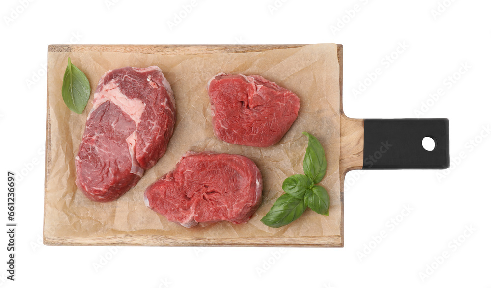 Fresh raw cut beef with basil leaves isolated on white, top view