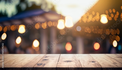 Empty wooden product stage and bokeh lights blurred the outdoor cafe background photo