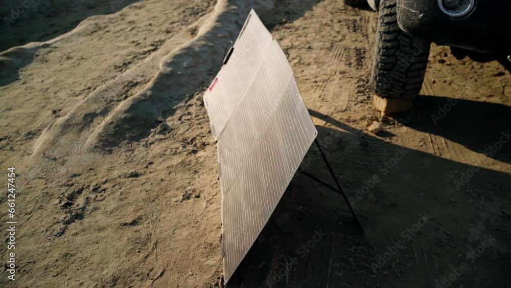 Portable solar panels to get power for offload vehicle, the adventure life concept, self-sufficiency with renewable energy. Portable solar panels to get power for offload vehicle, the adventure life concept, self-sufficiency with renewable energy.