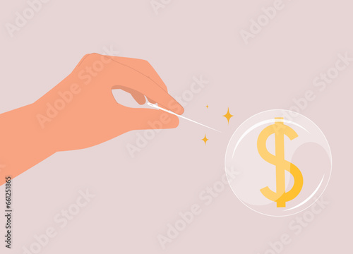 Concept Of Bubble Bursting Economy. A Person’s Hand Using Needle To Burst A Bubble With Money Sign. Close-Up.