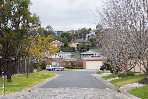 Tableau sur toile Winter view of a suburban road leads to a court, an enclosed road or cul-de-sac