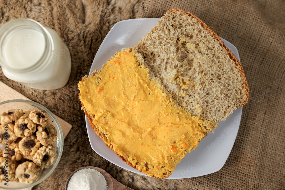 Bread with salted egg spread on a plate for healthy breakfast Bread with salted egg spread on a plate for healthy breakfast