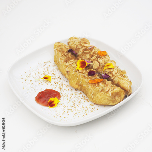 Crispy Banana Fritter Delight with Cheese, Almond Topping, and Strawberry Jam Dip
